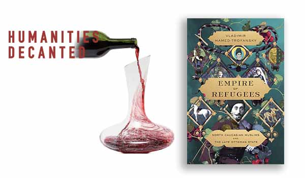 a wine decanter and an image of hamed-troyansky's book empire of refugees